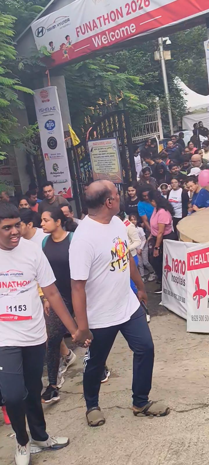 Participants walking through the Funathon 2026 welcome archway at the start of the walkathon